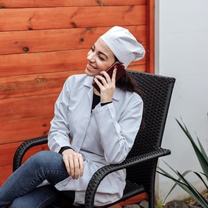 doctor-smiling-on-phone