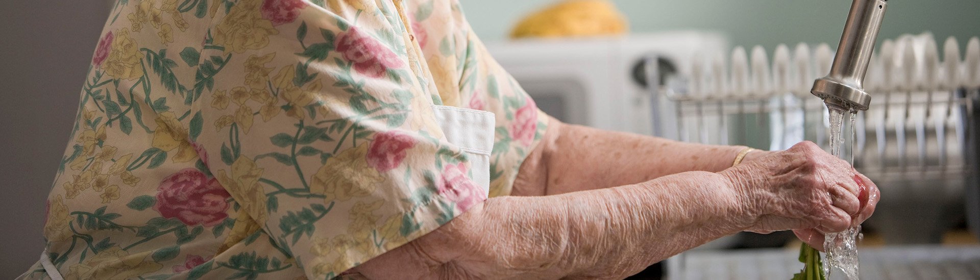older-person-washing-hands